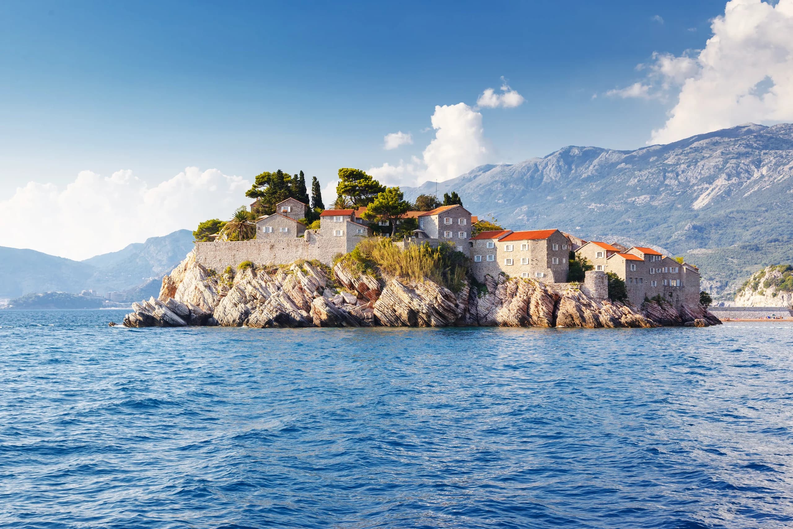 Sveti Stefan islet on the Budva Riviera, red roofs above the Adriatic